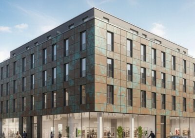 Mehrgeschossiges Gebäude mit PV-Fassade in Kupferoptik – nachhaltige Architektur mit energieerzeugender Gebäudehülle
